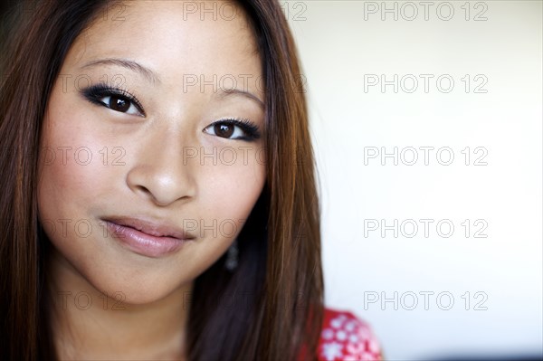 Close up of smiling mixed race teenage girl