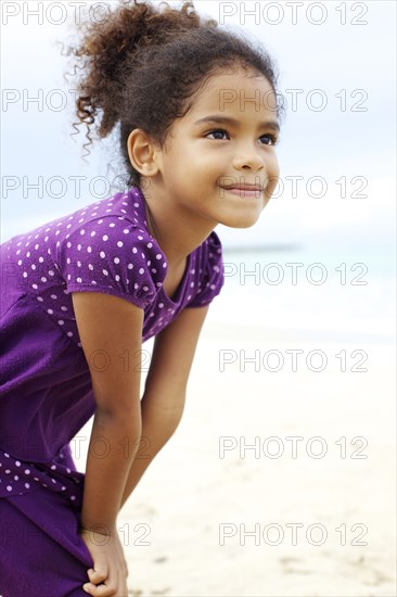 Mixed race girl on beach