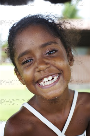 Grinning mixed race girl