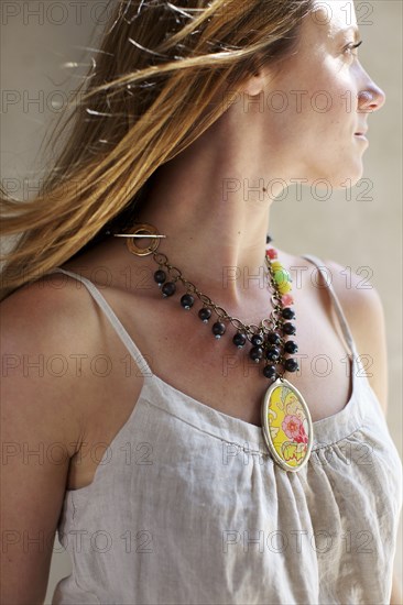 Caucasian woman wearing necklace