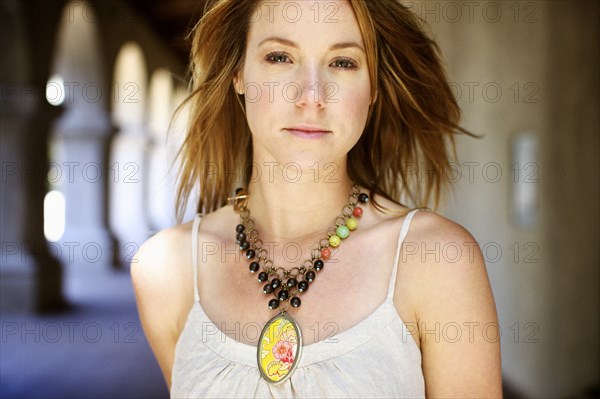 Caucasian woman wearing necklace