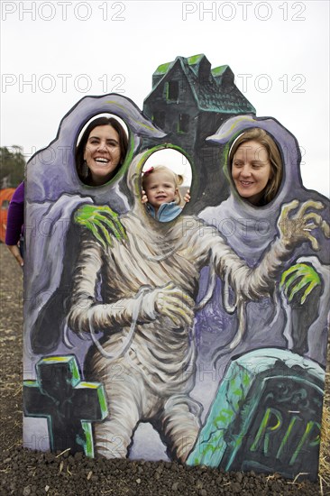 Family enjoying Halloween decoration