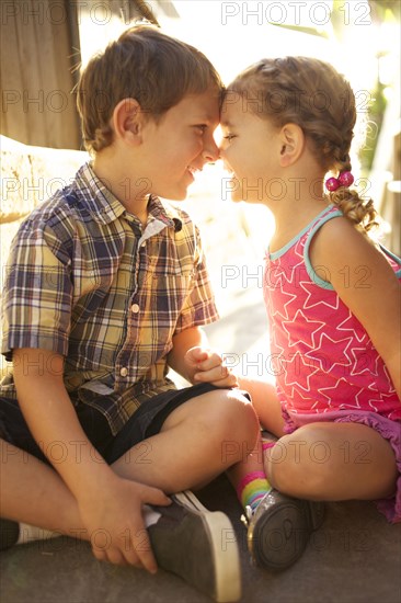 Brother and sister looking at each other