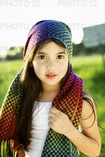 Mixed race girl wearing colorful headscarf