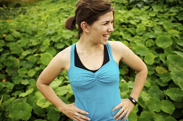 Athletic mixed race woman standing outdoors