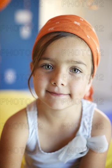 Mixed race girl wearing bandana