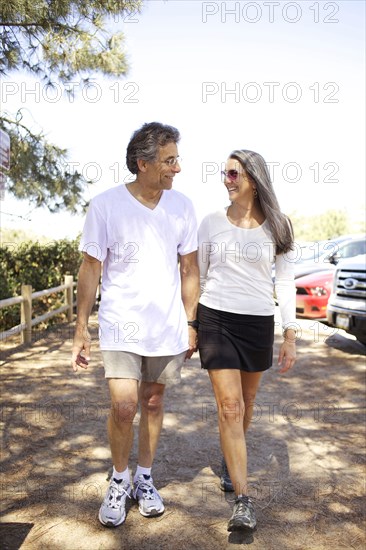 Older Caucasian couple walking outdoors