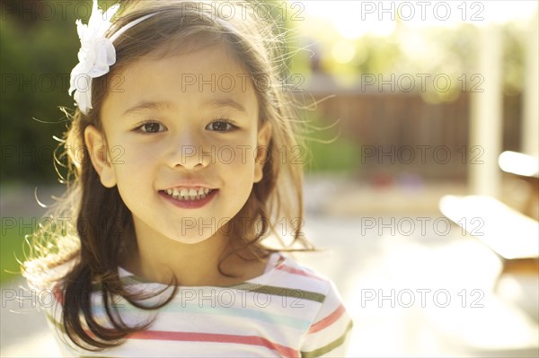 Mixed race girl smiling outdoors