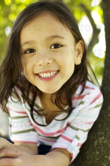 Mixed race girl smiling outdoors