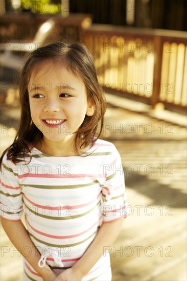 Mixed race girl smiling outdoors