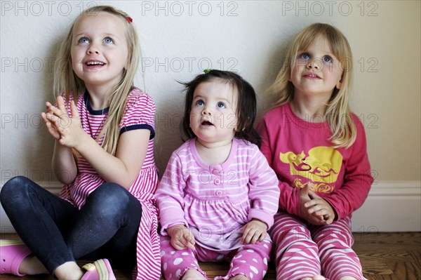 Girls sitting together on floor