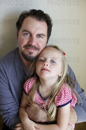 Father and daughter smiling