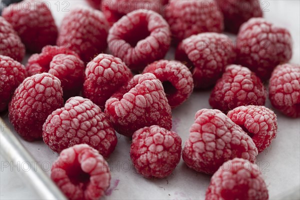 Close up of frozen red raspberries