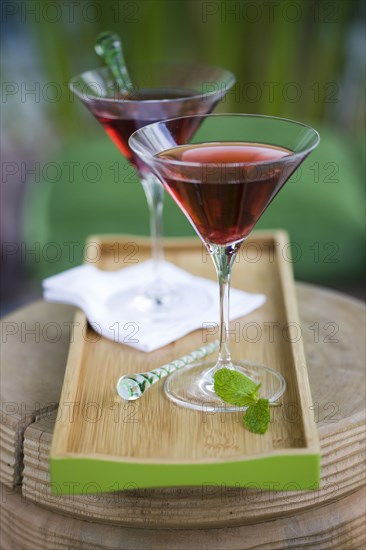 Cocktails in martini glasses on tray