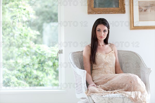 Elegant Caucasian woman sitting in chair