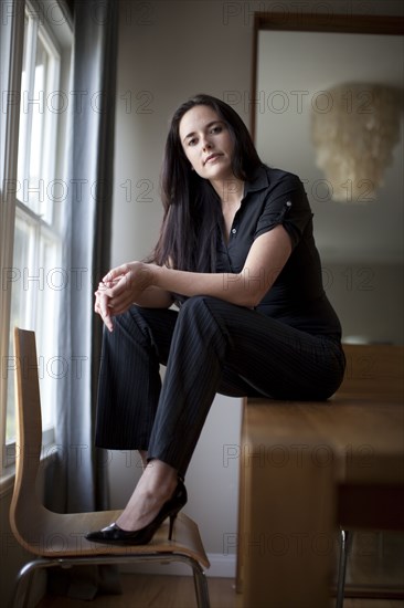 Caucasian businesswoman sitting in table