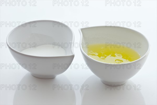 Bowls with sugar and egg whites