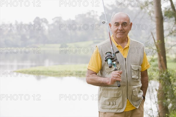 Senior Hispanic man fishing