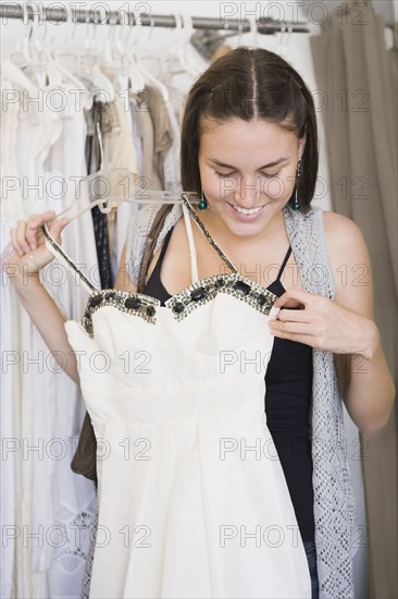 Hispanic woman shopping for wedding dress