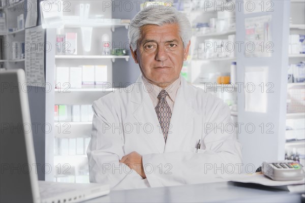 Hispanic pharmacist in drug store