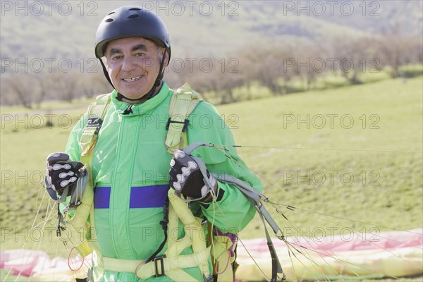 Senior Hispanic man skydiving