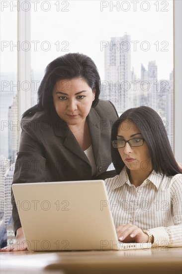 Businesswomen using laptop