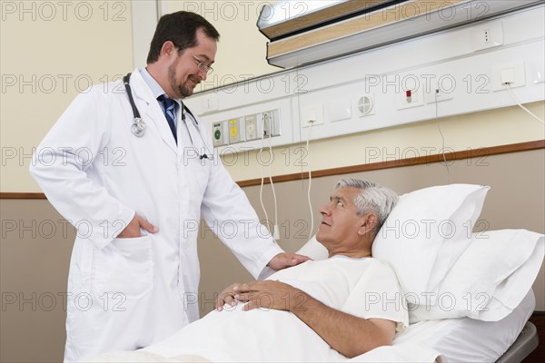 Doctor talking with patient in hospital