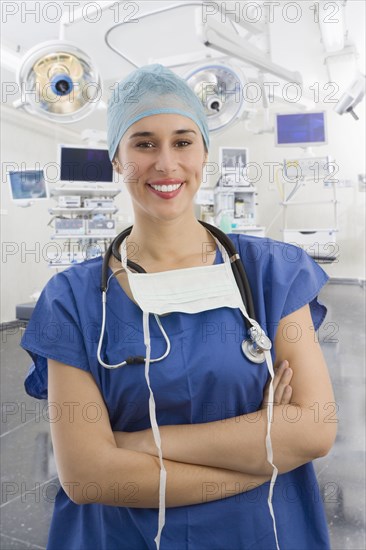 Mixed race surgeon in operating room