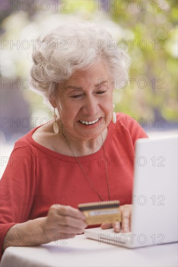 Chilean woman shopping online with credit card