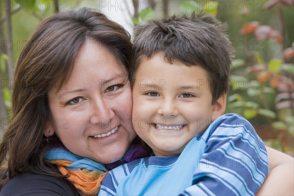 Chilean mother hugging son