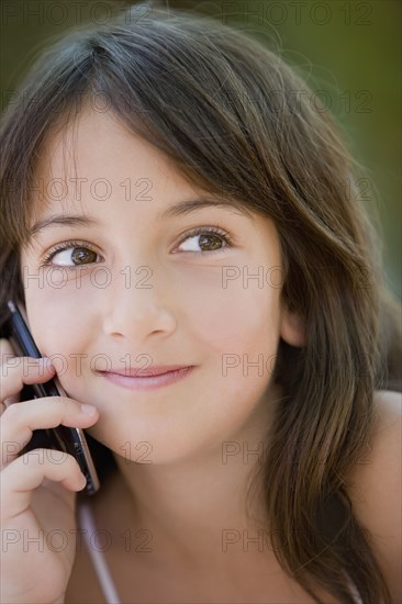 Hispanic girl talking on cell phone
