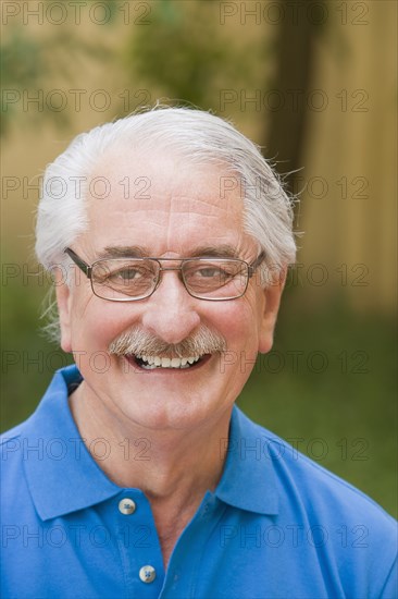 Smiling senior Hispanic man