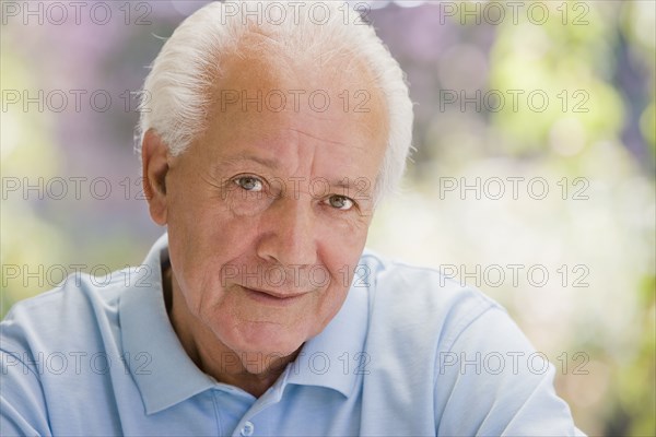 Serious senior Hispanic man