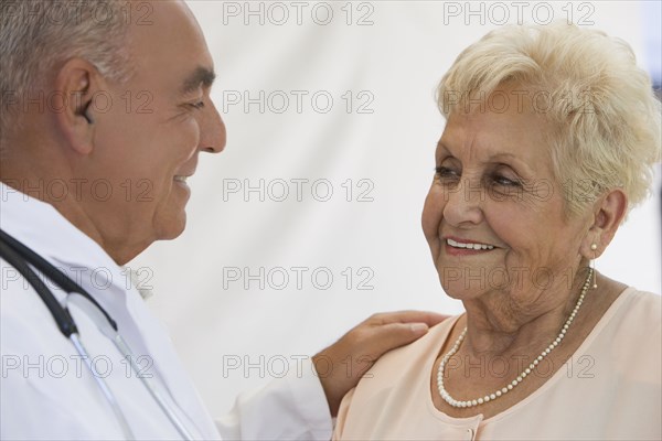 Senior woman talking with doctor