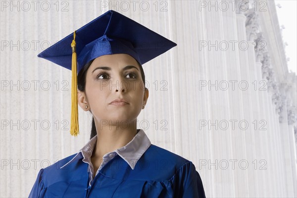 Graduating Turkish woman in mortarboard and cap and gown