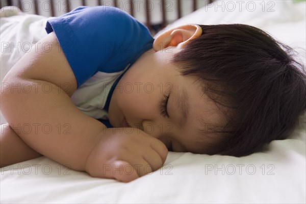 Hispanic baby boy napping