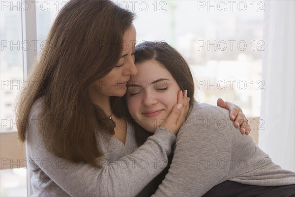 Chilean mother hugging daughter