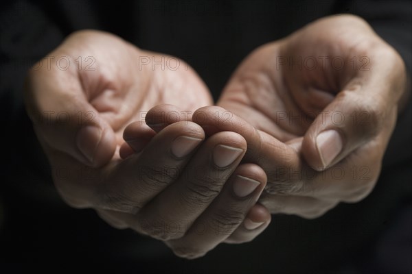 Close up of mixed race man's hands