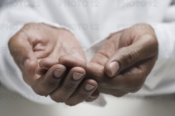 Close up of mixed race man's hands