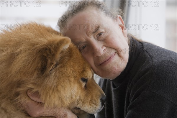 Chilean woman hugging dog