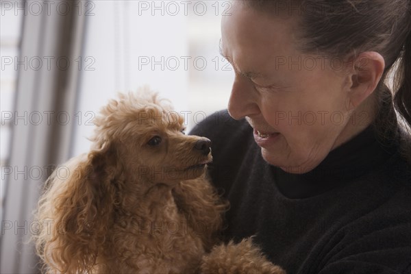 Chilean woman hugging dog