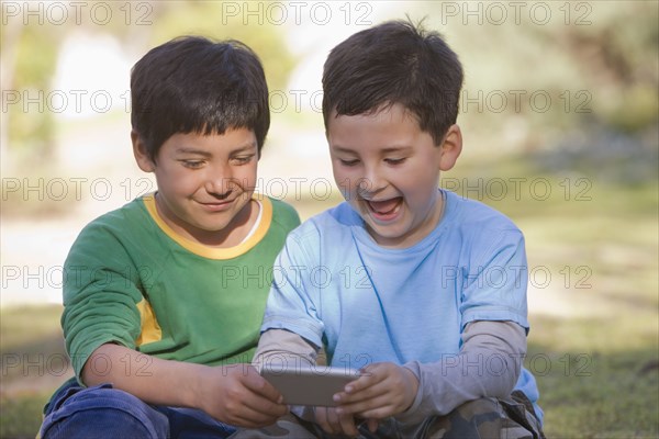 Chilean boys looking at cell phone