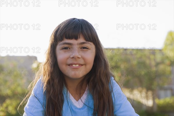 Smiling Chilean girl outdoors