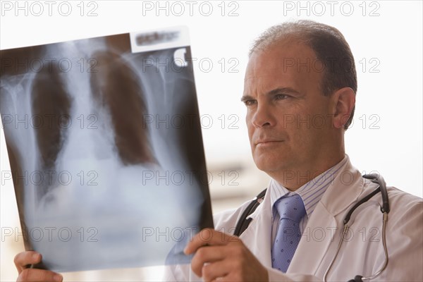 Chilean doctor reviewing x-rays