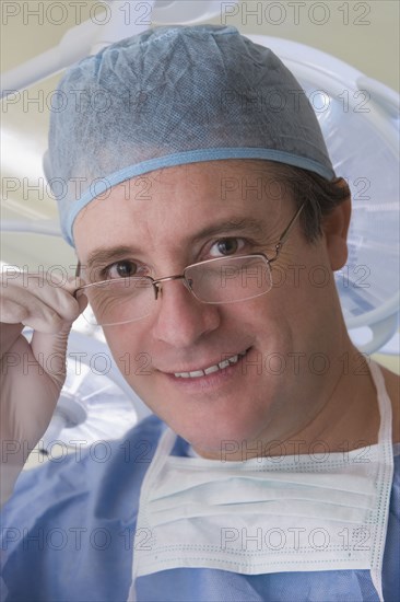 Caucasian surgeon in scrubs