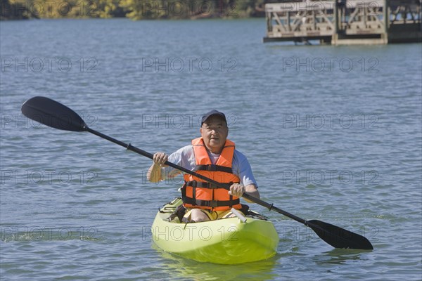 Chilean man paddling kayak