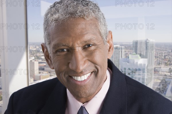 Smiling mixed race businessman