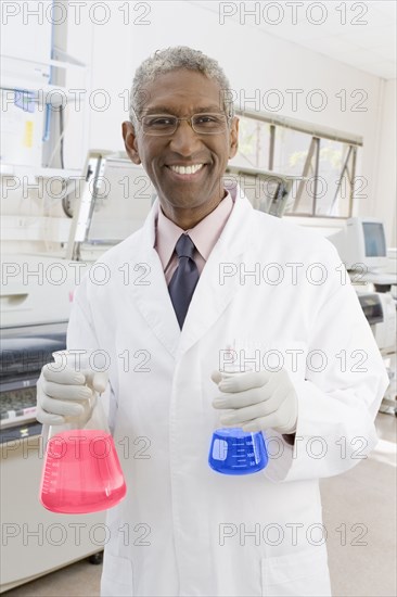 Mixed race scientist working in lab