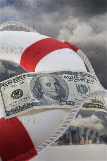 Dollar bill attached to life preserver