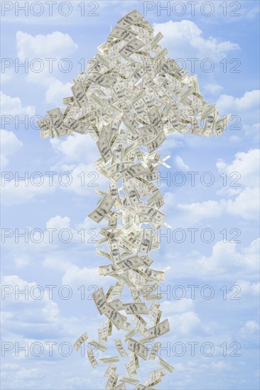 Illustration of dollar bills making arrow in sky